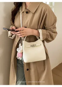 Minimalist litchi pattern bucket bag, stylish commuter shoulder crossbody handbag for women.