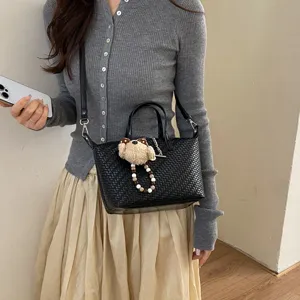 Chic woven dumpling handbag for women, stylish daily commuter crossbody bag with cute bear.