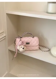 Pink quilted chain crossbody bag with cute plush bear pendant, elegant vintage style.