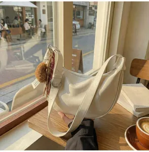 Vintage crescent hobo shoulder bag for women, casual PU leather crossbody handbag detail view.