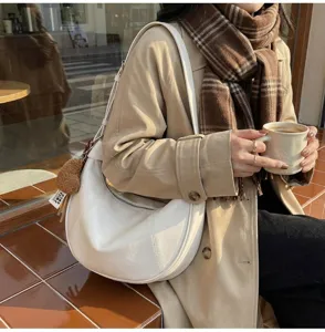 Minimalist white crescent shoulder bag, stylish PU leather hobo bag for daily casual use.