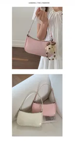 Chic minimalist leather shoulder bag for women, elegant underarm hobo bag with cute bear charm.