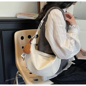Trendy retro white hobo shoulder bag for women, casual Korean style crossbody bag with plush charm.