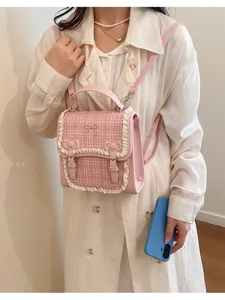 Pink plaid bow backpack for women, stylish sweet style crossbody and shoulder bag detail view.