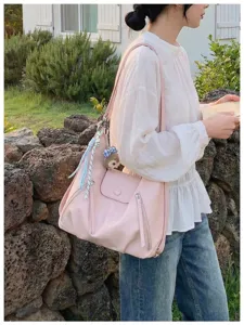 Zaino e borsa a tracolla multifunzionale rosa elegante per donne da lavoro quotidiano.