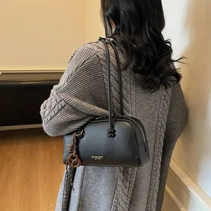 Retro casual black bowling shoulder bag for women, versatile PU leather pillow handbag.