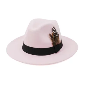 Pink felt fedora hat detail, featuring black ribbon and decorative feather design.