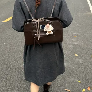 Vintage dark brown PU leather Boston bag, chic shoulder handbag with cute puppy pendant.