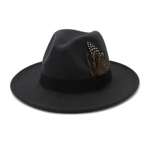 Dark grey wool fedora hat detailed view, elegant jazz cap with black band and feather accent.