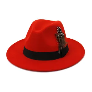 Red wool fedora hat with black band and feather detail, classic wide flat brim jazz cap.