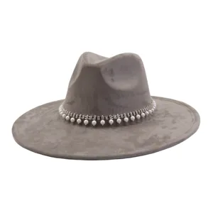 Detail shot of the grey suede fedora hat featuring an elegant pearl and rhinestone band.