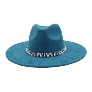 Close-up of blue faux suede fedora hat detail featuring sparkling pearl rhinestone band.