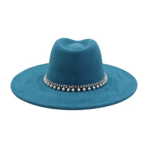 Detailed view of blue suede fedora hat featuring elegant pearl and rhinestone trim band for autumn.
