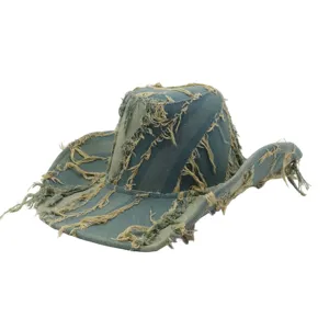 Close up of distressed frayed denim western cowboy hat, showing textured fabric details.