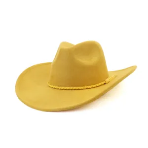 Yellow suede cowboy hat detail showing soft fabric texture and woven braided hatband.