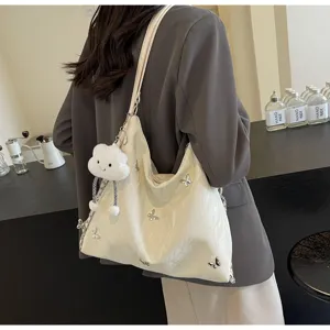 Large capacity butterfly shoulder tote bag for women, trendy commuter bag with cloud charm.