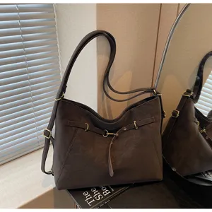 Versatile brown vintage women shoulder backpack, commuter casual convertible multi-use bag.