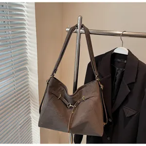 Brown vintage multi-way shoulder bag detail, casual commuter tote bag hardware display