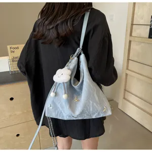 Large capacity blue tote bag for women, trendy casual shoulder bag with cute cloud charm.