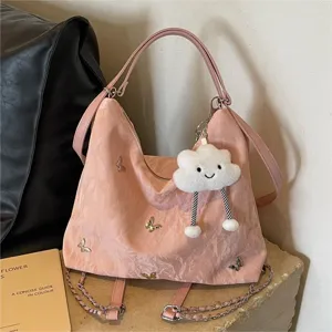 Large capacity pink tote bag for women with cute butterfly charms and plush cloud pendant stylish.