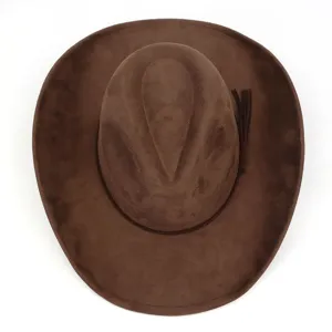 Detailed view of brown suede cowboy hat, showing top crown and side tassel decoration.