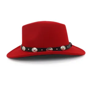 Red felt cowboy hat detail showing black leather belt and silver metal concho studs.