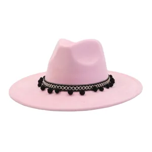 Pink faux suede fedora hat with black and white woven band and pom poms for women men