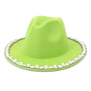 Detail view of a lime green fedora hat featuring elegant pearl and rhinestone brim trim.