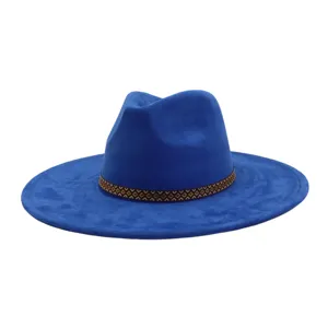 Close up detail view of blue suede fedora hat showing soft texture and geometric patterned band.