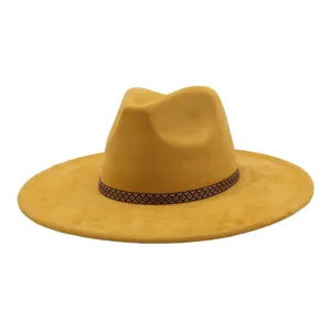 Detailed view of the yellow suede fedora hat showcasing its stylish geometric patterned band.