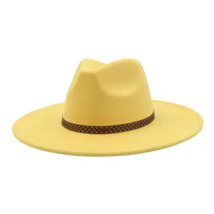 Yellow suede wide-brim fedora hat with brown geometric patterned band, stylish unisex cap.