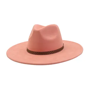 Pink suede fedora hat detail featuring a brown patterned ribbon band and wide brim design.