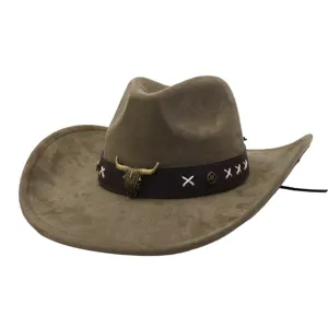Detail shot of suede cowboy hat showing metal bull skull ornament and cross stitching.