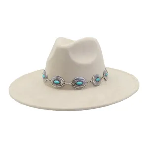 Detailed view of beige suede fedora hat with vintage turquoise concho band for women ethnic style.