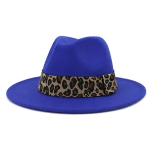 Close-up detail of blue woolen fedora hat featuring a stylish leopard print band.