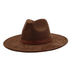 Brown suede fedora hat with patterned leather band, wide flat brim, stylish autumn wear.