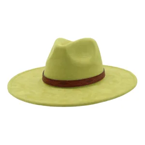 Close-up detail of light green suede fedora hat featuring a stylish brown patterned leather band.