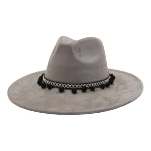 Grey suede fedora hat with ethnic black woven pom pom band for men and women detail view