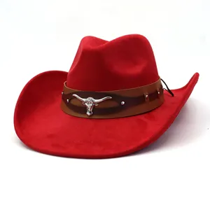 Red suede western cowboy hat detail with brown leather band and silver bull skull emblem.