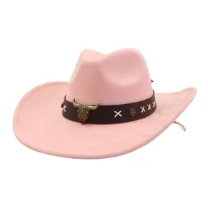 Pink suede western cowboy hat with brown band, metal bull skull ornament and wide brim.
