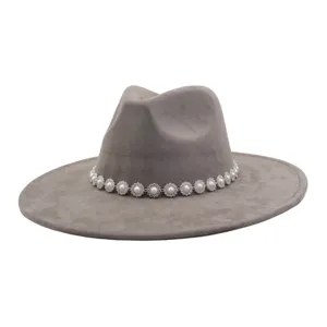Detailed view of grey suede fedora hat featuring a delicate pearl and crystal flower chain band.