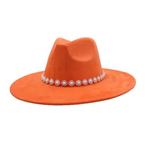 Orange suede felt fedora hat close-up featuring a delicate pearl rhinestone floral band.