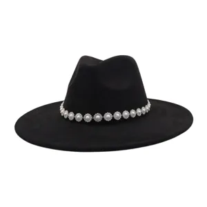 Black suede fedora hat with elegant pearl rhinestone flower band, wide flat brim gentleman style.
