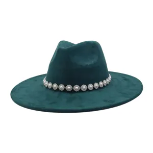 Close-up detail of dark green suede fedora hat featuring a sparkling rhinestone pearl flower band.
