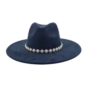 Close-up of dark blue suede fedora hat featuring elegant pearl rhinestone flower band.