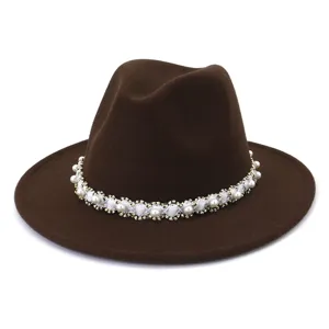 Close-up detail of the elegant brown fedora hat featuring a delicate pearl beaded band.