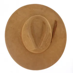 Close-up detail of a classic brown suede fedora hat featuring a stylish side tassel strap.