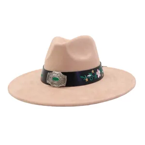 Close-up detail view of the exquisite floral embroidered black band and vintage silver buckle.