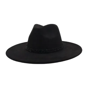 Black suede fedora hat detail, wide brim design with sparkly band, elegant fashion accessory.
