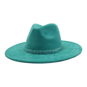 Detailed view of teal suede fedora hat featuring a sparkling crystal rhinestone decorative band.